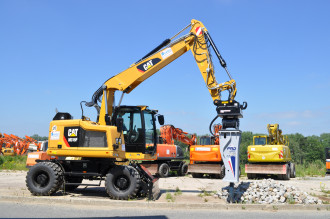 Radbagger Kurzheck CAT M315F OilQuick OQ65 SH Plauen